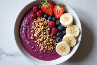 A colorful smoothie bowl with fresh fruits and granola